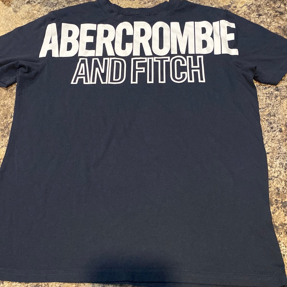 Boy’s Abercrombie t-shirt size 13/14 color is navy and white
